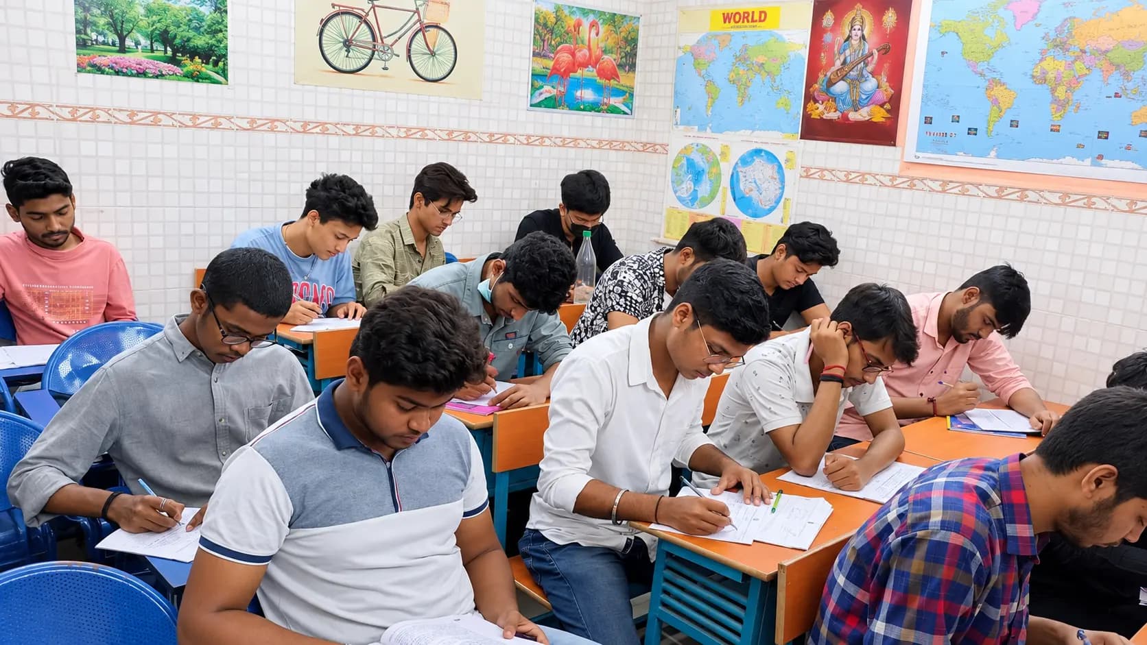 Students concentrating on written work at their classroom desks